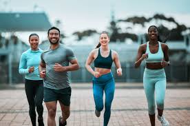 Sculpting Sleek Arms: The Essential Role of Cardio in Toning Without Bulking Up 3 image of people running to incorporate cardio Harrogate exercise into their life to help tone arms and body.